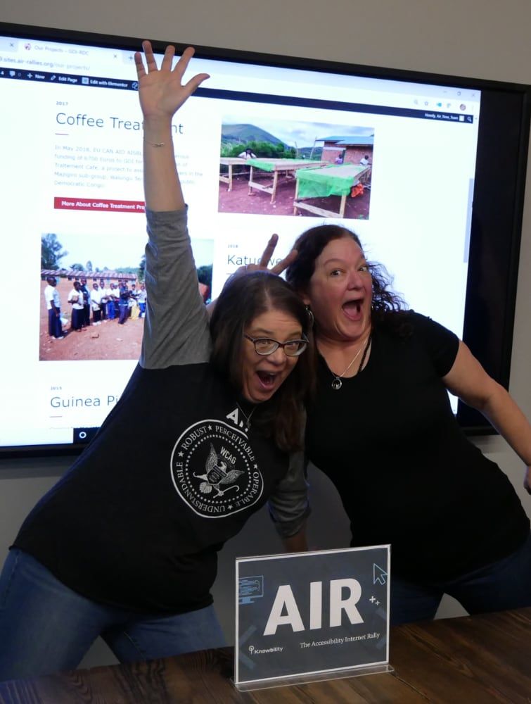 Two women celebrating at the AIR competition.