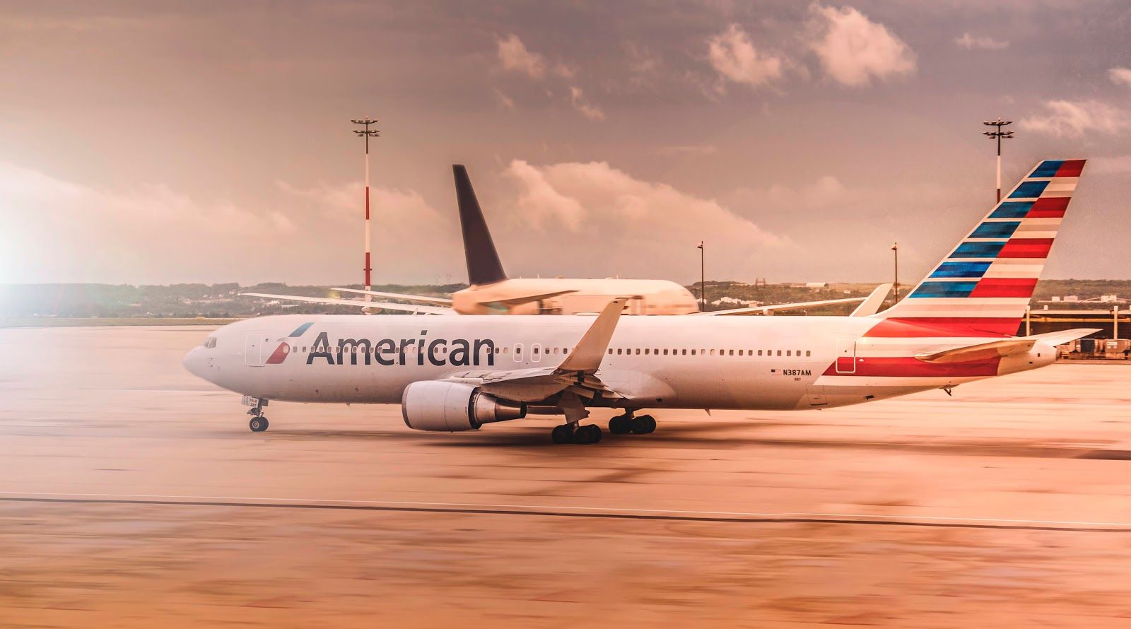 Image of a plane with an American Airlines logo sitting on a runway.