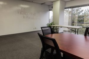 Knowbility meeting room with a wall board